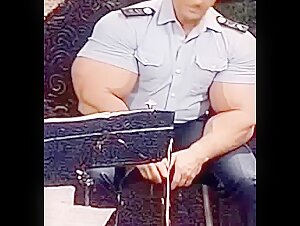 Massive Biceps in ultra-tight Military Shirt