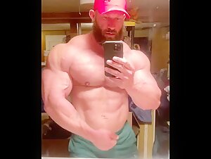 Lumberjack grunts and flexes his sweaty pumped body